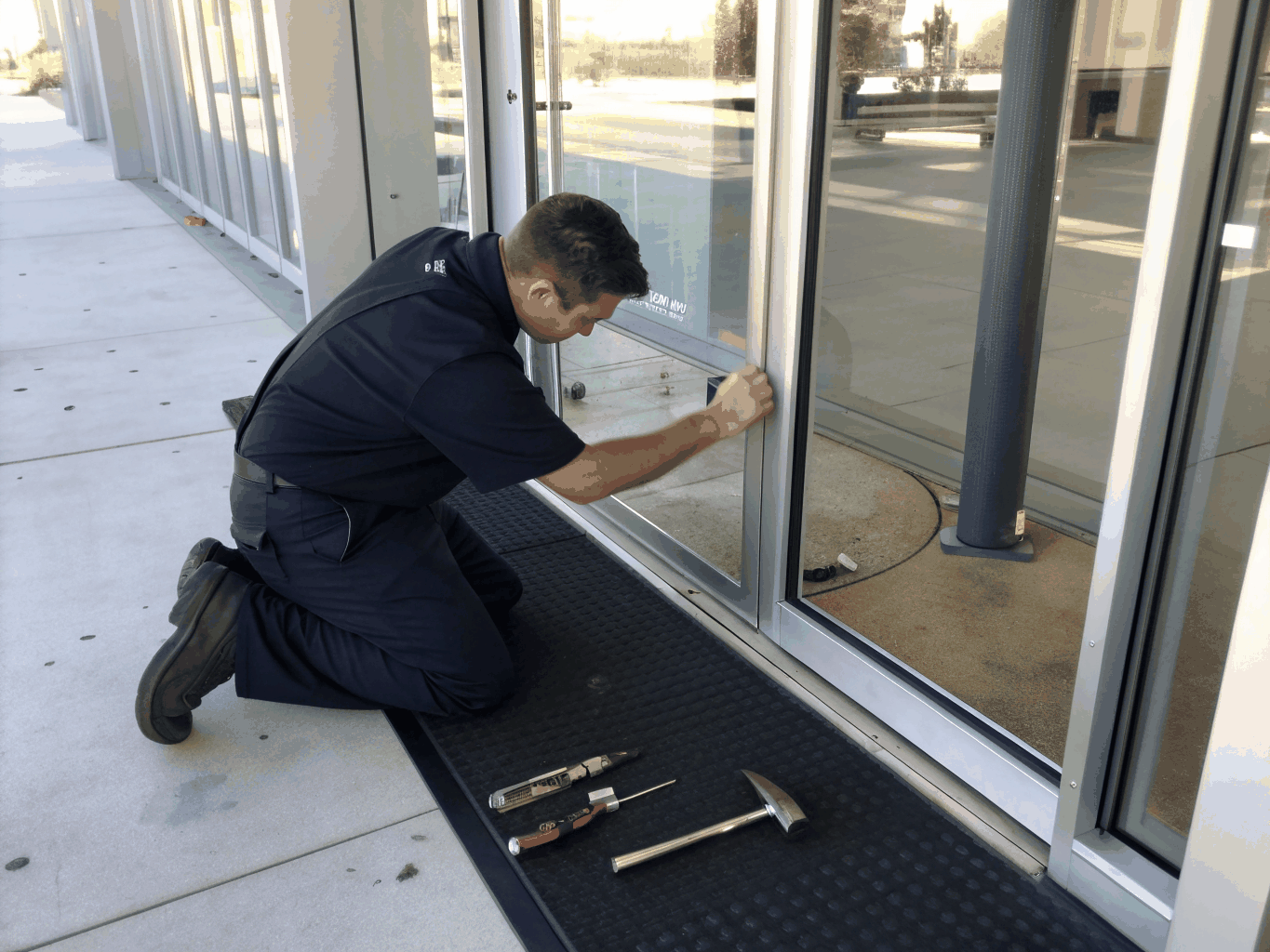 Commercial glass door hardware installation and maintenance