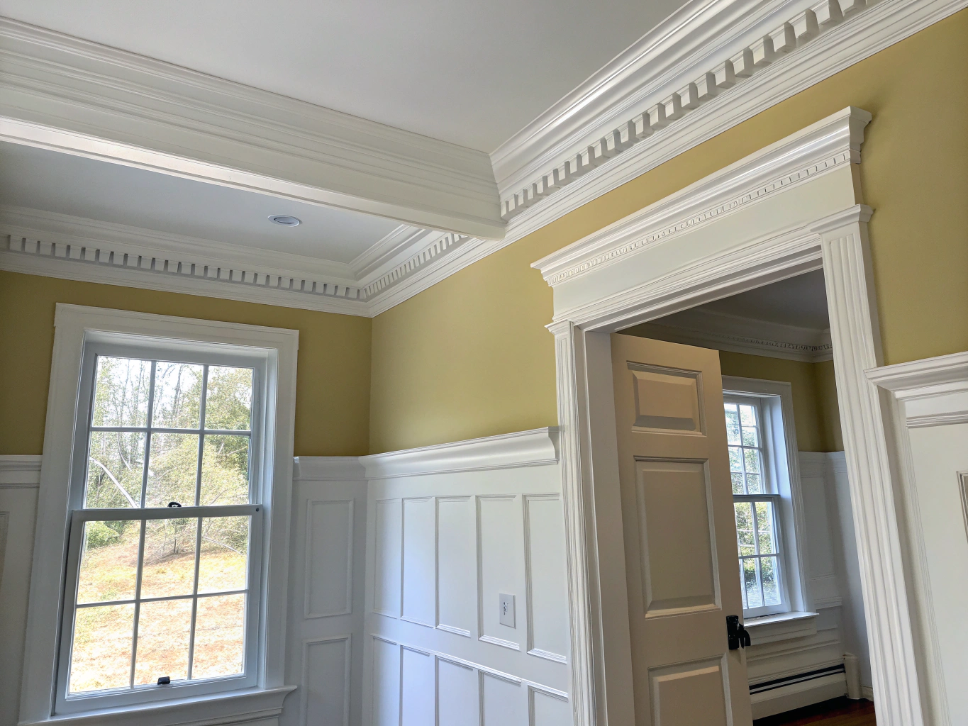Custom crown molding and carpentry work in living room