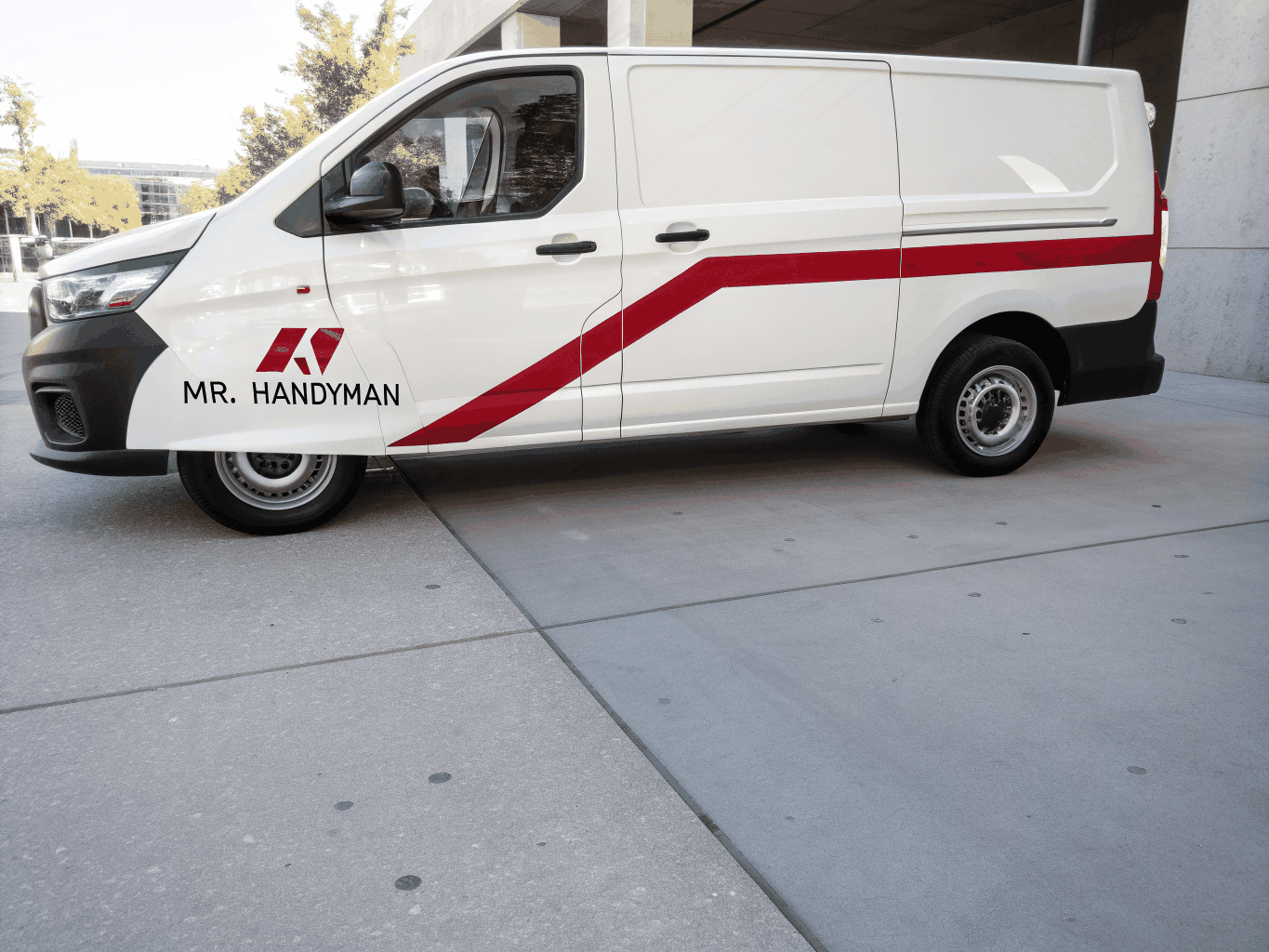 Right Hand Man branded service van parked in front of a modern craftsman storefront