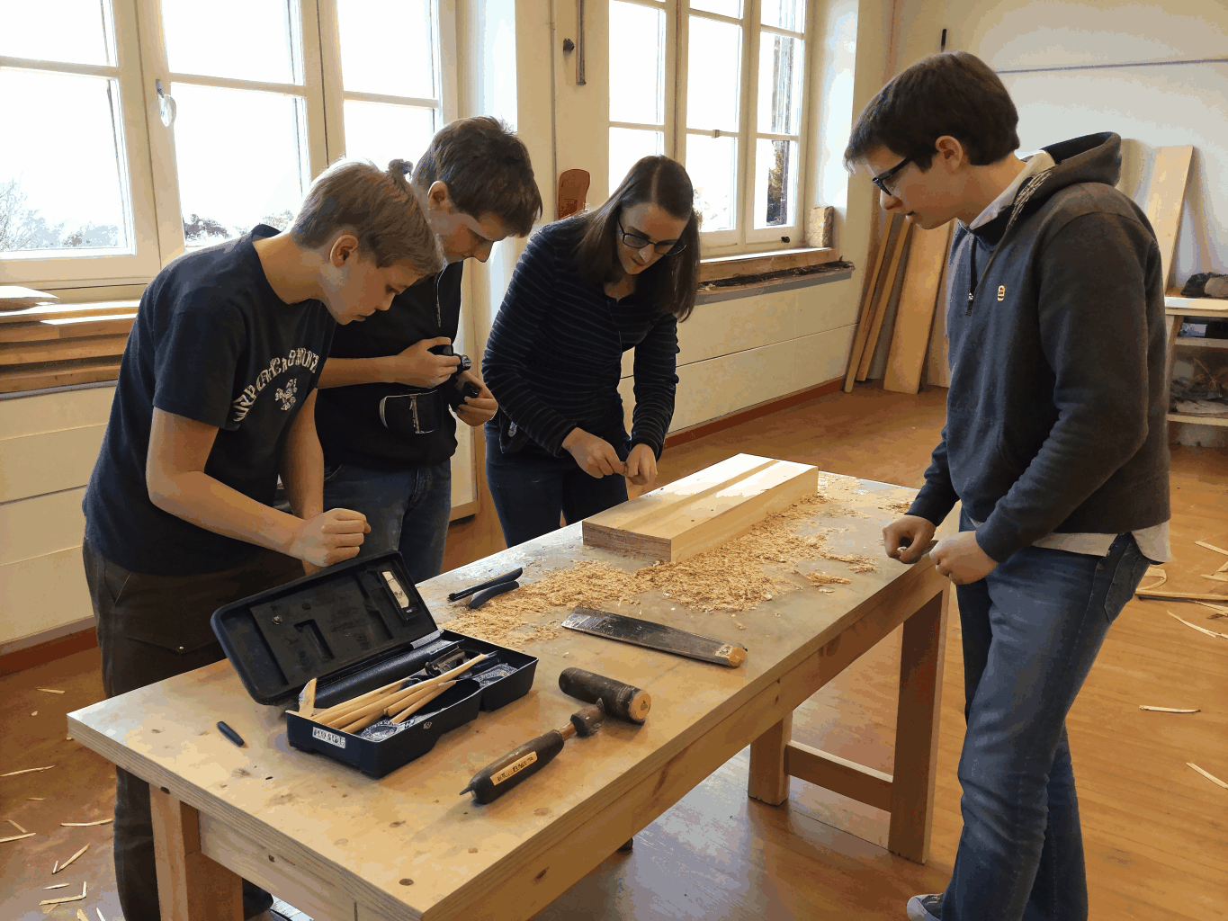 Technicians undergoing hands-on carpentry and repair training